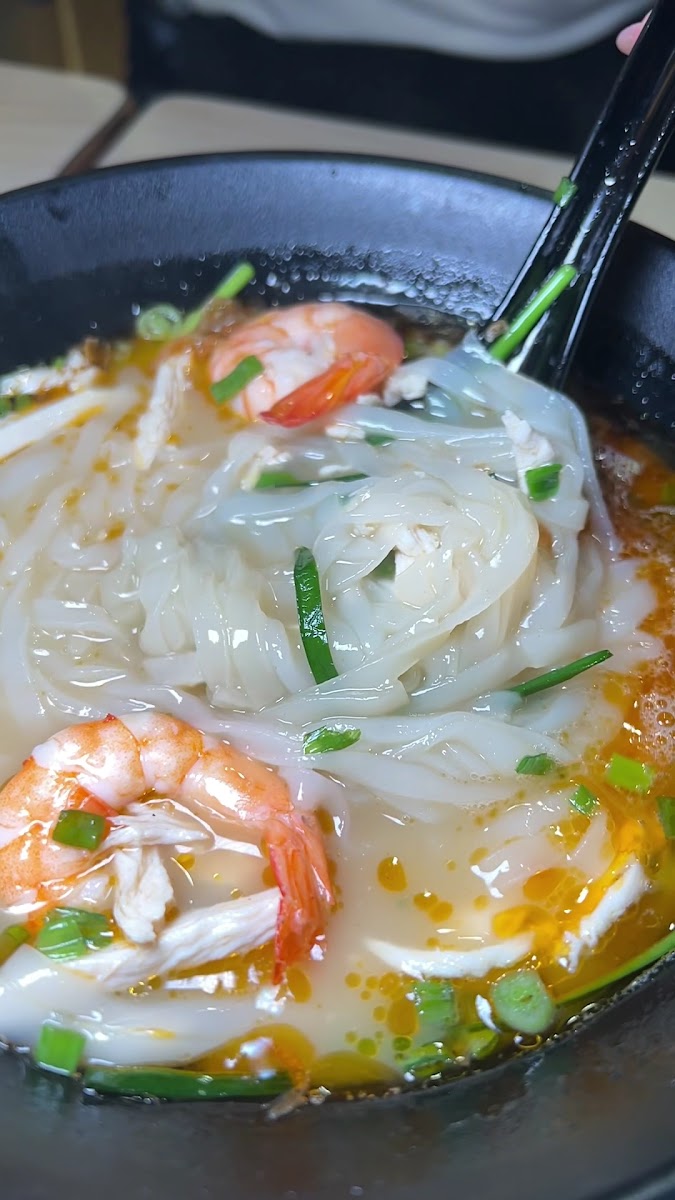 A flavorful bowl of Curry Mee, rich and aromatic.